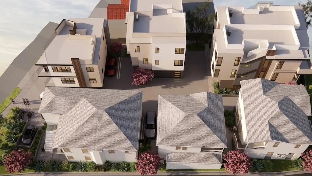 Aerial rendering of the whole Burnside project: new three-story flat-roof homes and the existing hip-roof buildings around a shared drive